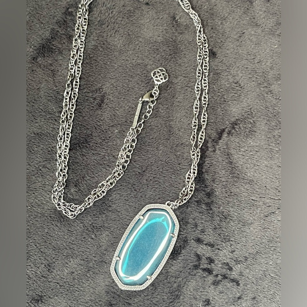 Kendra Scott gunmetal and blue iridescent crystal long necklace.